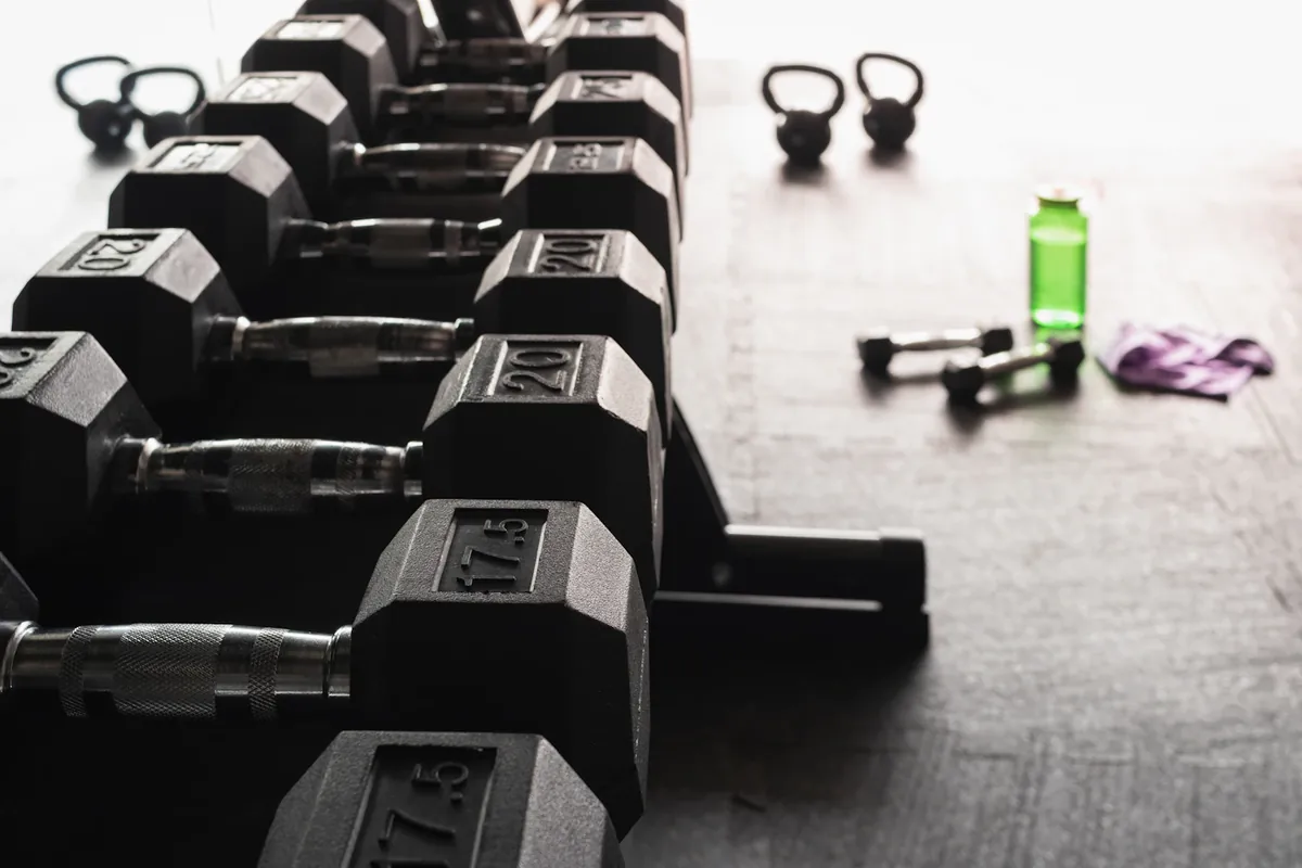Dumbbells, kettlebells and a mat in a compact training area