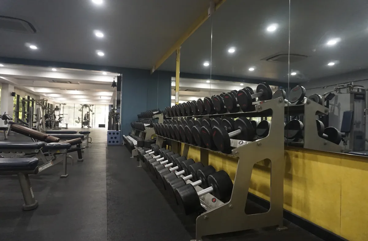 An organised dumbbell rack in a gym